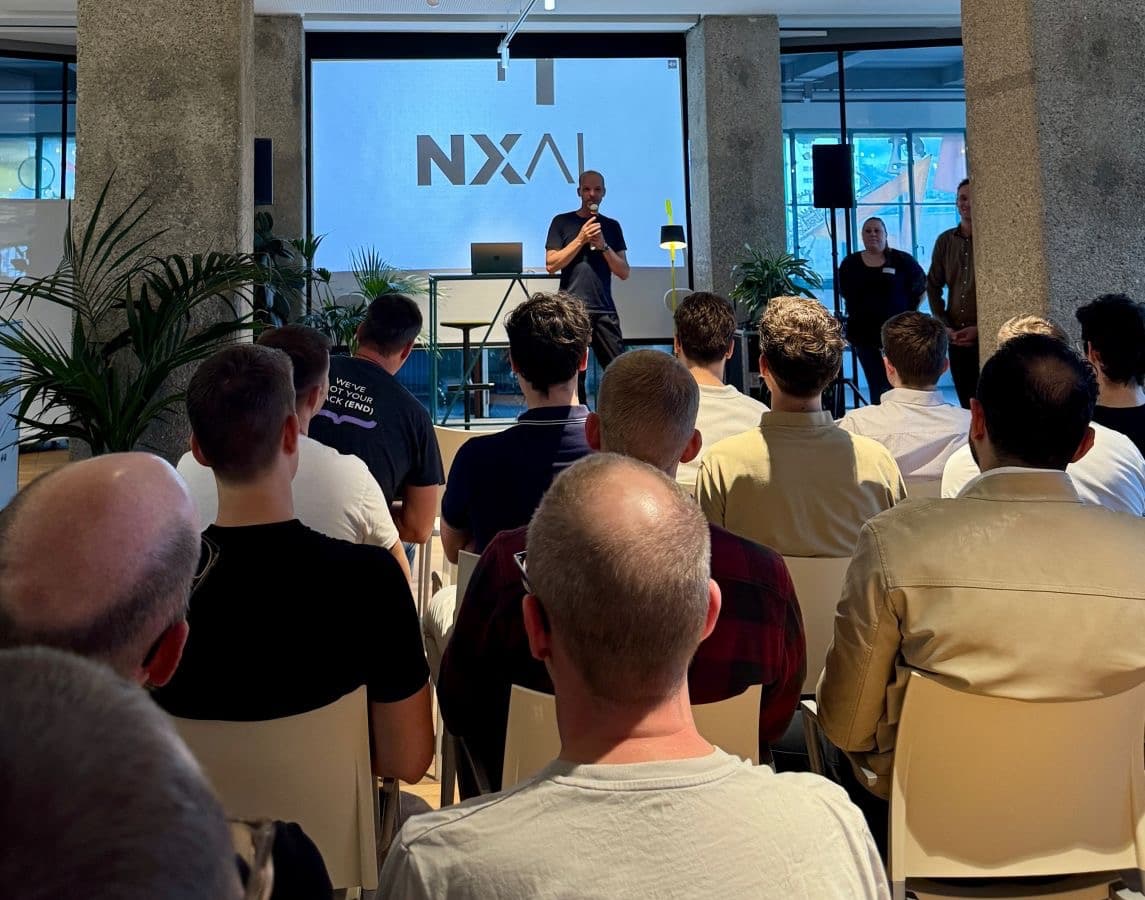 KI Bowle audience watching a safety and AI talk at the NXAI Office in Linz