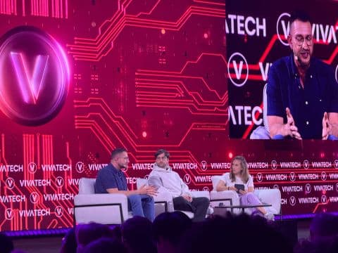 AI leaders speaking on a VivaTech conference stage
